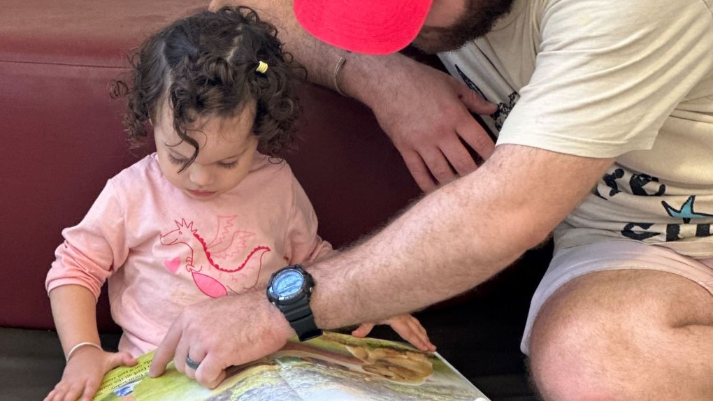 CMS Toddler reading with Dad